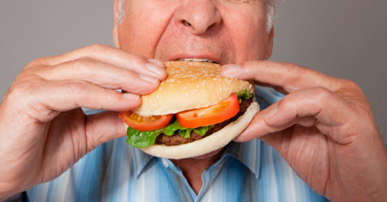 man eating a burger