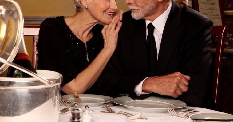 Elderly couple looking at each other