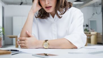 Upset woman at a desk