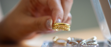 Person with jewelry tray