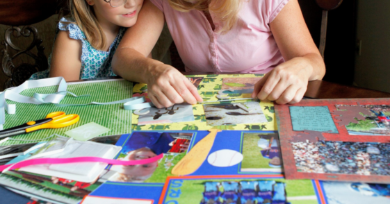 parent and child making a scrapbook