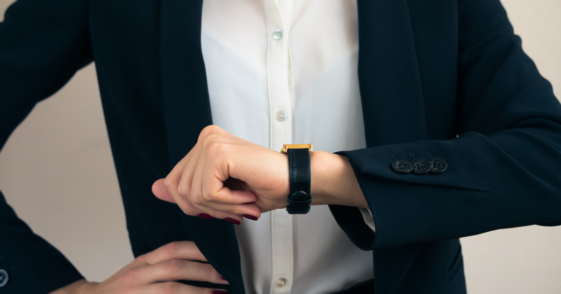 woman looking at watch