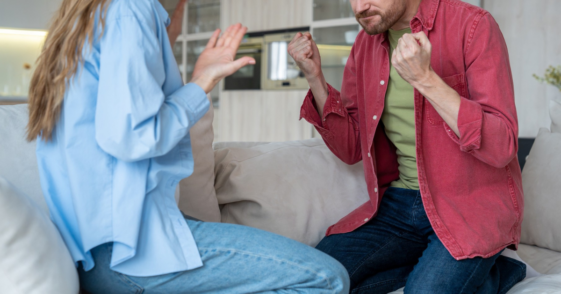 couple arguing on couch