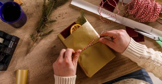 person wrapping handmade gift