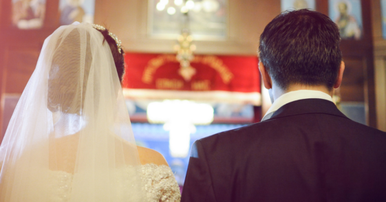 bride and groom at altar