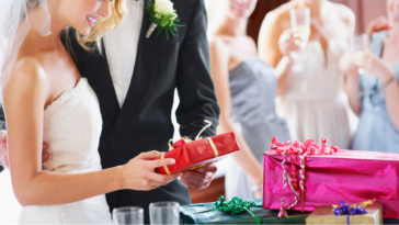 Bride and groom opening gifts