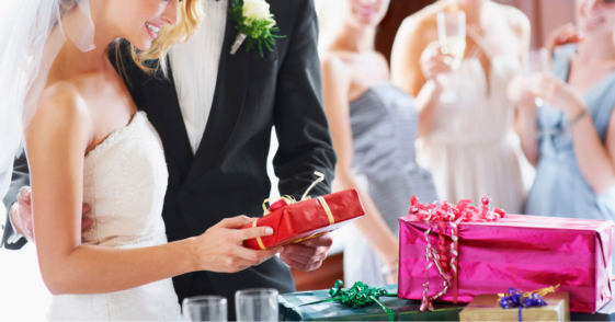 Bride and groom opening gifts