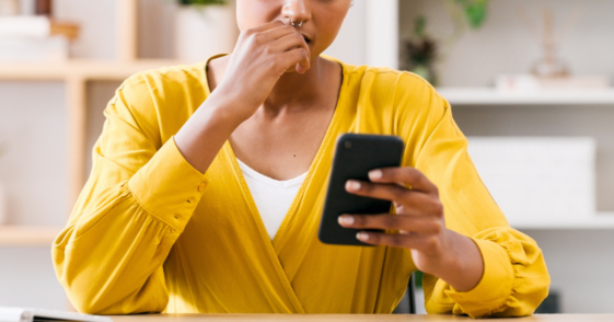 Woman angry while looking at her phone