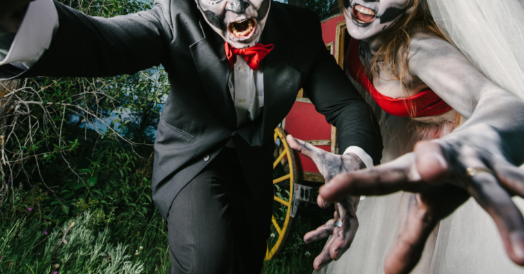 A bride and groom in a halloween wedding