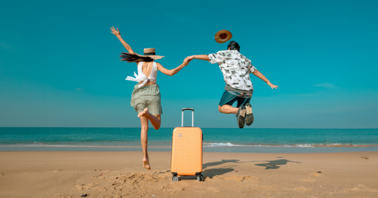 Excited couple on the beach