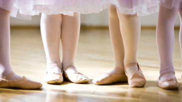 children’s feet in ballet shoes