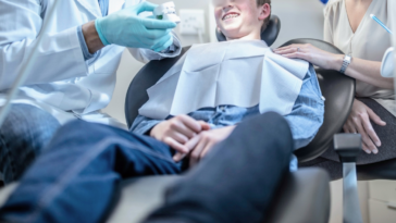 orthodontist treating boy