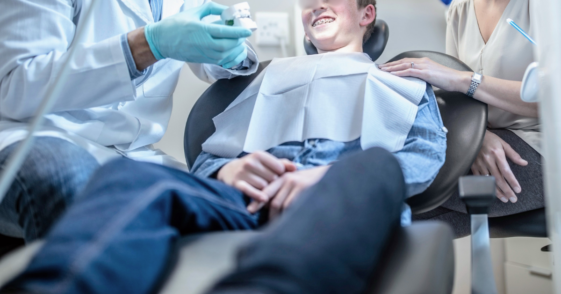 orthodontist treating boy