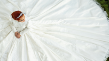 bride with wedding gown spread around her