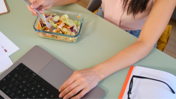 Woman eating lunch at work