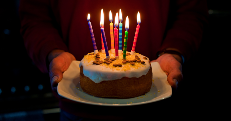 Man holding birthday cake