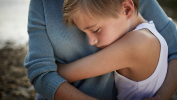 mother and son hugging