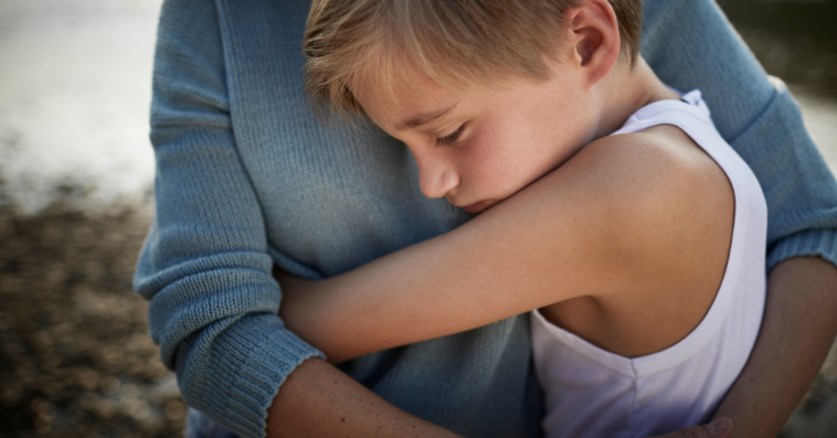 mother and son hugging