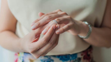 A woman looking at her wedding ring