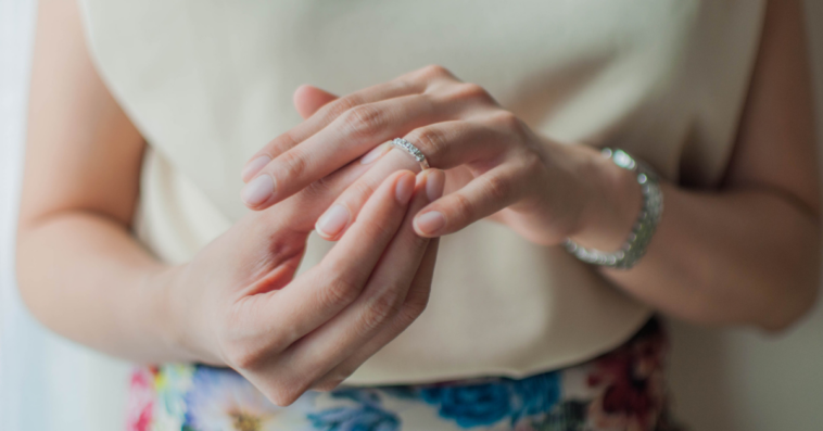 A woman looking at her wedding ring