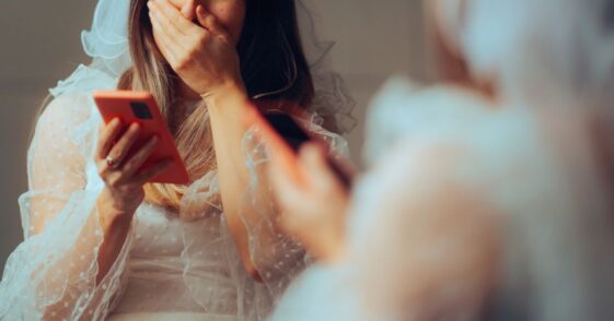 Unhappy, Crying Bride Reading Text Messages.