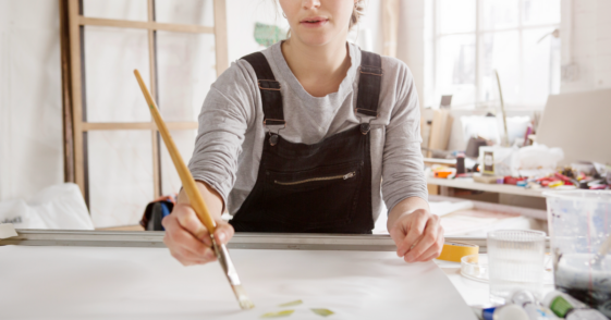 A woman painting.