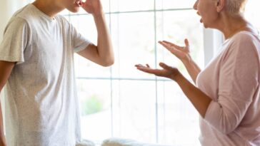 Mother and her teenage son argue at home.