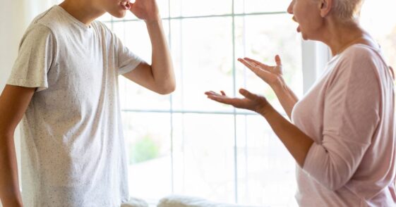 Mother and her teenage son argue at home.