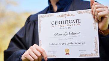 Person holding a degree