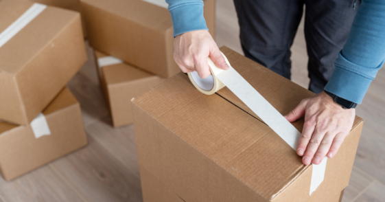 Person packing moving boxes