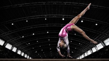 Woman gymnast on balance beam