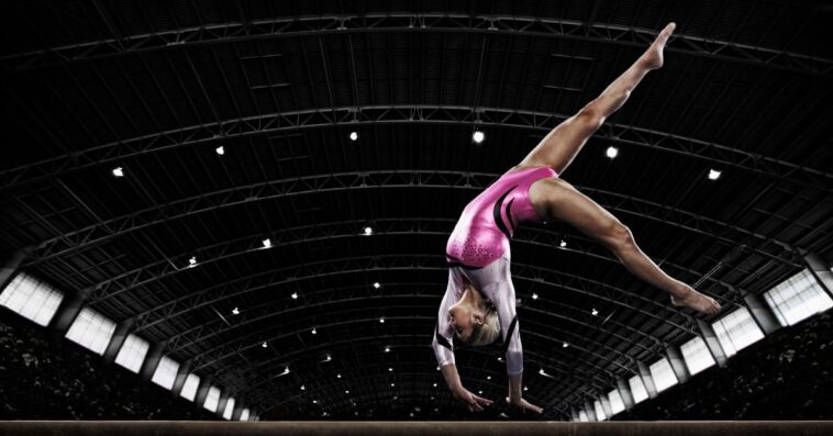 Woman gymnast on balance beam