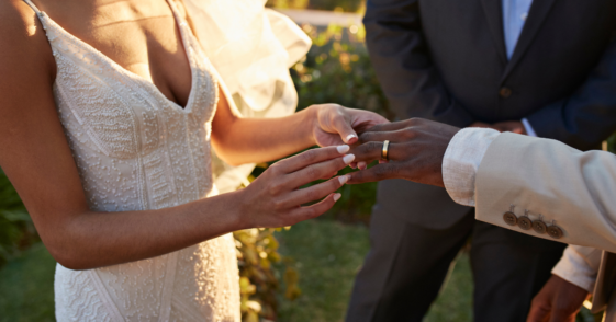 Bride and groom exchanging rings