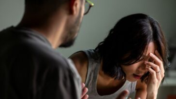 Young married couple after a fight. Angry couple ignoring each other, relationship troubles.