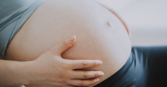 Close-up of a pregnant woman's belly.