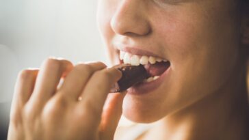 Woman eating chocolate