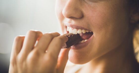 Woman eating chocolate