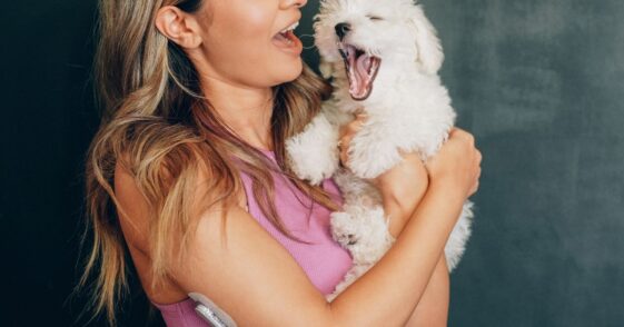 Woman holding pet dog