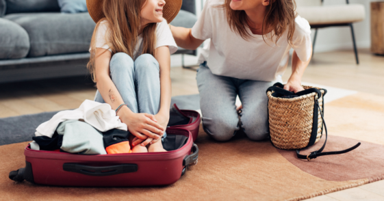 Mom packing kids' bags for a trip