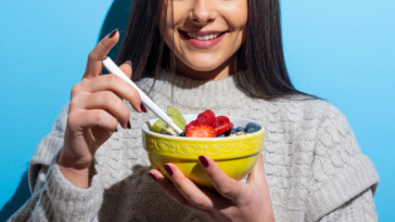 young woman with bowl of fruit