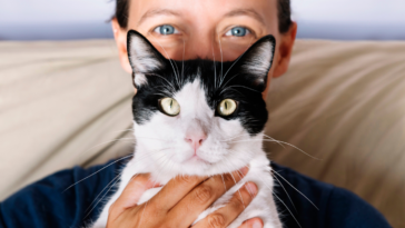 Woman holding her cat