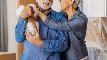 Elderly couple packing boxes