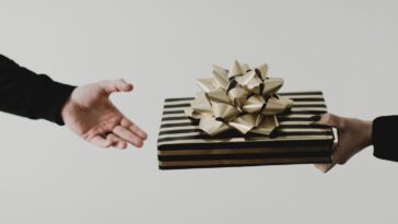 Person receiving wrapped present