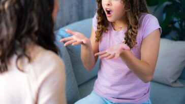 Teenager arguing with her mom on the couch