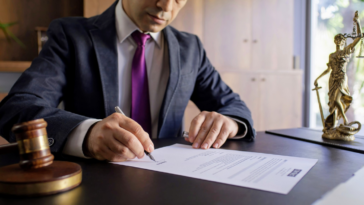 lawyer signing legal document