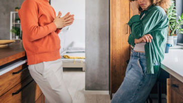 couple arguing in kitchen