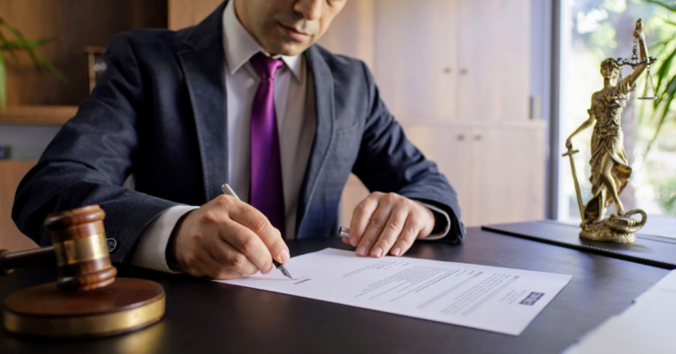 lawyer signing legal document