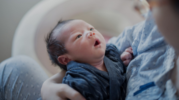 woman holding infant