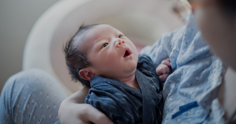 woman holding infant