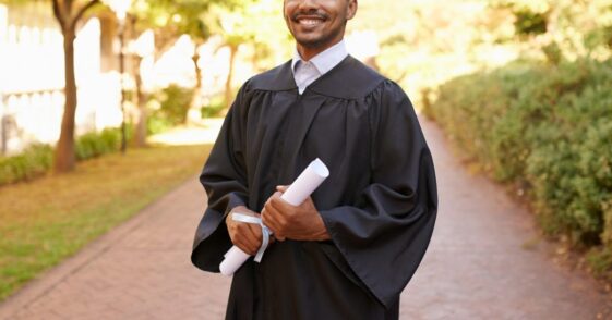 Cropped portrait of a handsome young man posing with his degree on graduation day.